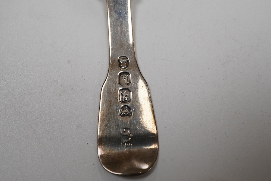 A George IV silver fiddle pattern caddy spoon, the bowl engraved with thistles, James Beebe, London, 1825, 90mm, a Georgian siler caddy spoon, the bowl embossed with urn and flowers, a late Victorian silver caddy spoon w